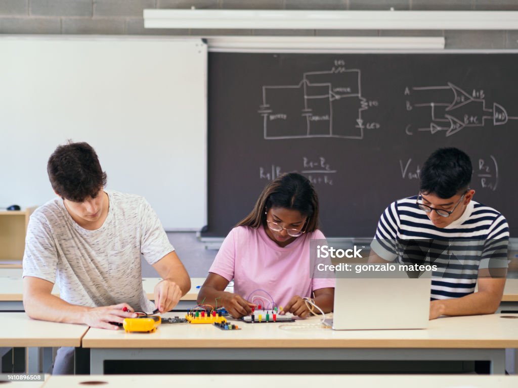 Versatile Students Three Multiethnic Students In The Technology Classroom Manipulating ...