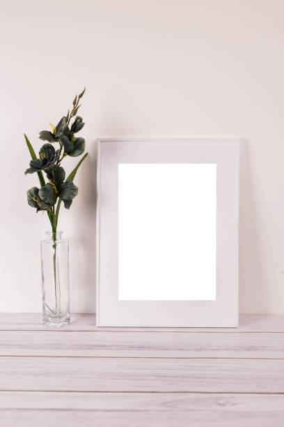 istock Mock up poster. Minimal template with empty picture frame mock up. White background, boho 1410898144