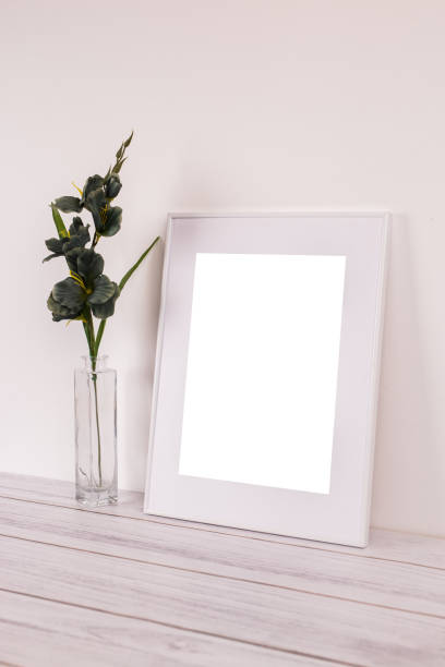 istock Mock up poster. Minimal template with empty picture frame mock up. White background, boho 1410898183