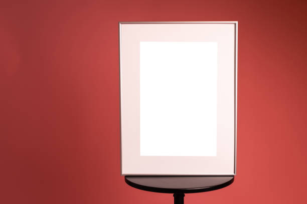 White picture frame with decorations. Mock up for your photo or text. Place your work, print art, white background, pastel color book. Photo realistic 3d illustration