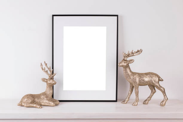 istock Mock up poster. Minimal template with empty picture frame mock up. Minimalist Christmas interior decoration, reindeer 1410899285
