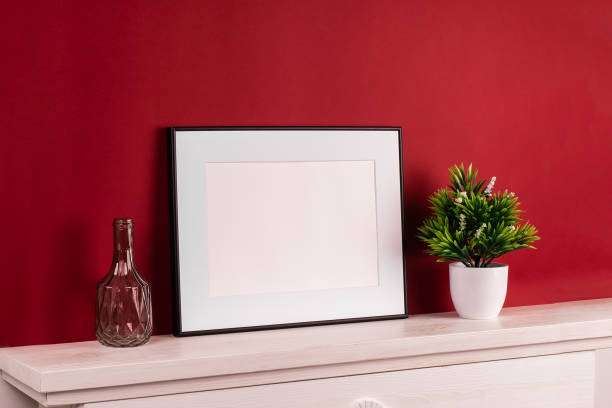 istock Mock up poster. Minimal template with empty picture frame mock up. Red background 1410899943