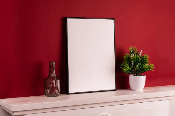 istock Mock up poster. Minimal template with empty picture frame mock up. Red background 1410899953