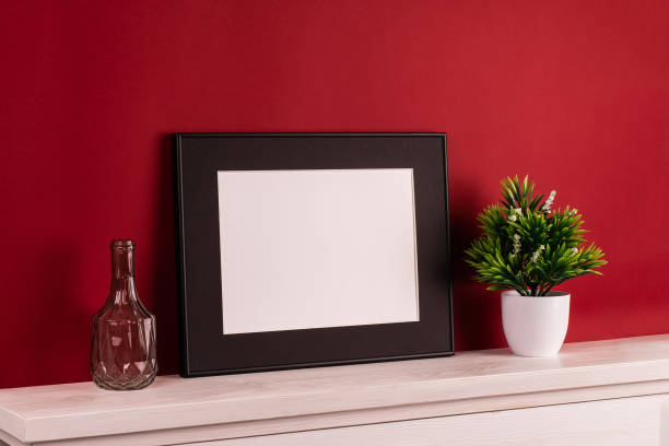 istock Mock up poster. Minimal template with empty picture frame mock up. Red background 1410899981