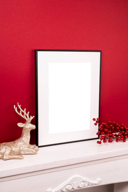 istock Mock up poster. Minimal template with empty picture frame mock up. Minimalist Christmas interior decoration, reindeer 1410899983