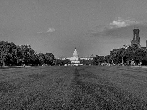 black and white picture of captiol building across the lawn from a distance
