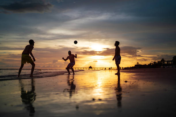 Salvador, Bahia, Brazil - December 22, 2019: People are seen having fun on the beach during sunset in the city of Salvador, Bahia.