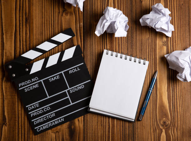 istock paper and a crumpled paper with cinematic clapperboard on a table 1410905547