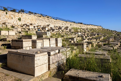 East Jerusalem, Palestine, May 3, 2019: View of the Jewish cemetery under the Mount of Olives in Jerusalem on a sunny spring day.