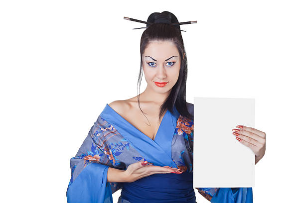 Beautiful woman in a kimono with blank billboard Beautiful woman in a kimono with blank billboard isolated on white background modern geisha stock pictures, royalty-free photos & images