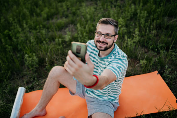 istock Yoga man taking a selfie 1410911703