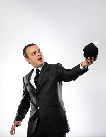 Businessman holding a bomb