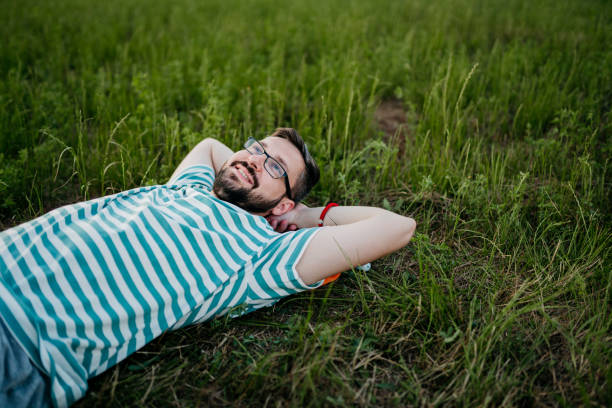 istock A man lies in the grass and dreams 1410914943