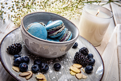 Macaron blueberry and Vanilla cookies sweet pastry with berries stock photo