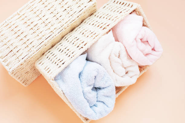 istock Towels in box on beige background top view, storage concept. 1410920948