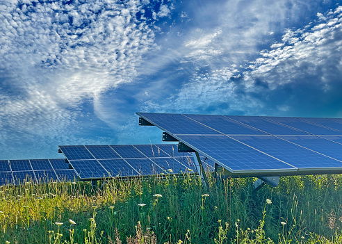 Solar energy, solar cell stations, and urban energy demand in the background.