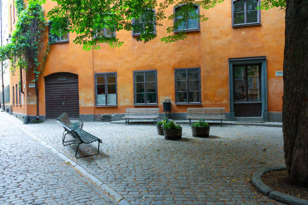 an empty plaza in Stockholm, Sweden with benches