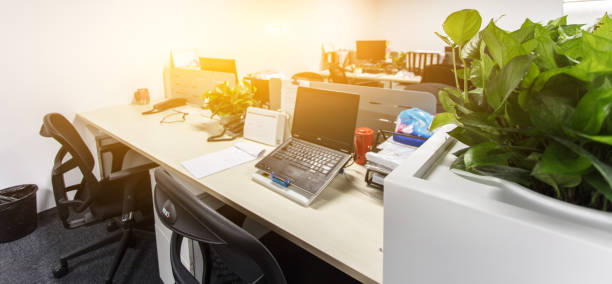 istock Modern business office  with blurred bokeh background. tables, chairs, computers. 1410927599