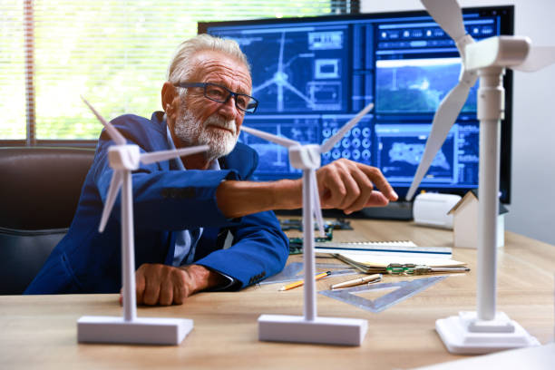 istock Senior Engineer or Professional engineer working design win turbine ,Green energy concept 1410929624