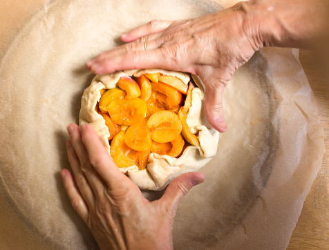 Hands Making Rustic Apricot Tart/Galette