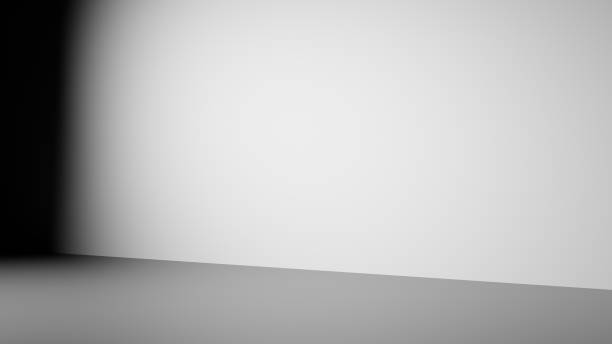 istock Intense light projecting on the wall and floor of an empty room 1410934974