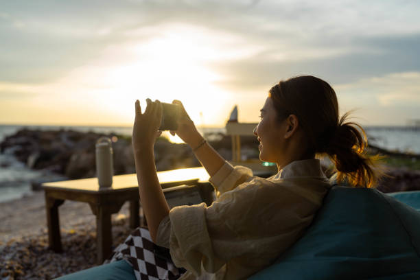 istock Sharing the summer day on social media. 1410939896