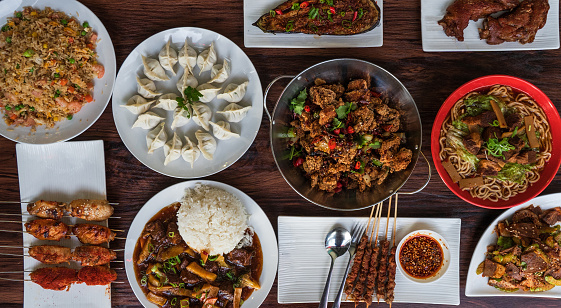 Table top view of variety of Chinese food.