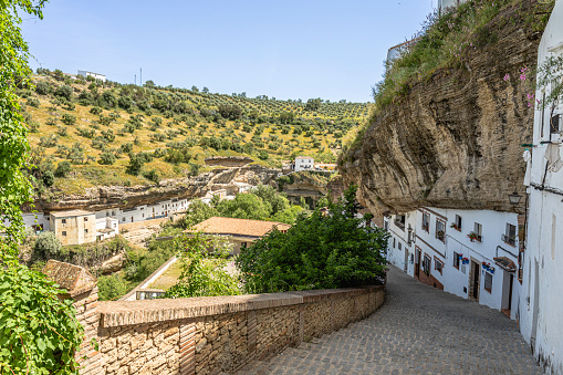 Setenil de las Bodegas is famous for its dwellings built into rock overhangs and adding an external wall.. According to the 2005 census, the city has a population of 3,016 inhabitants.