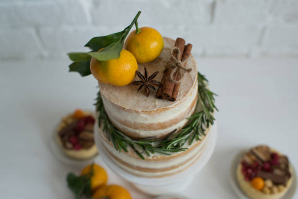 Delicious pastries decorated with tangerines and chocolate