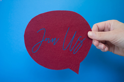 Speech bubble in front of colored background with Join Us text.