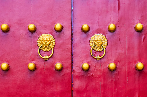 Detail of ancient city gate, red and gold