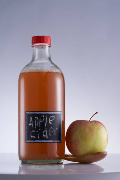 istock Close up  bottle of apple cider vinegar and fresh apple 1410949409
