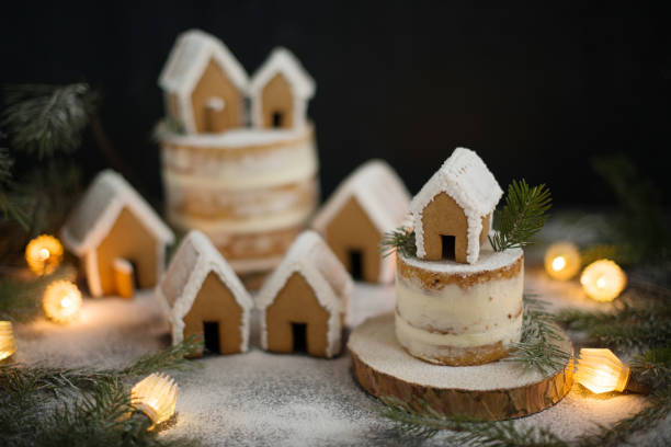 istock Gingerbread Christmas houses sprinkled with powdered sugar 1410949445