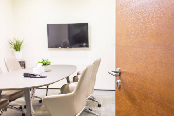 conference room door in modern office opened - board room business conference table window imagens e fotografias de stock