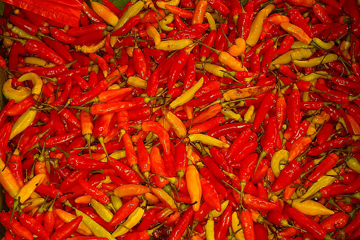 When shopping at a fruit and vegetable stall in Pamulang, southern Tangerang, Indonesia in July 2022, a basket of red chili pepper