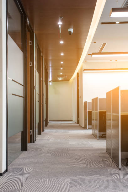 istock Working area in modern office with carpet floor and meeting room 1410955431