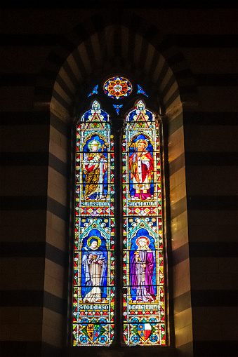 Stained glass of angels holding cup