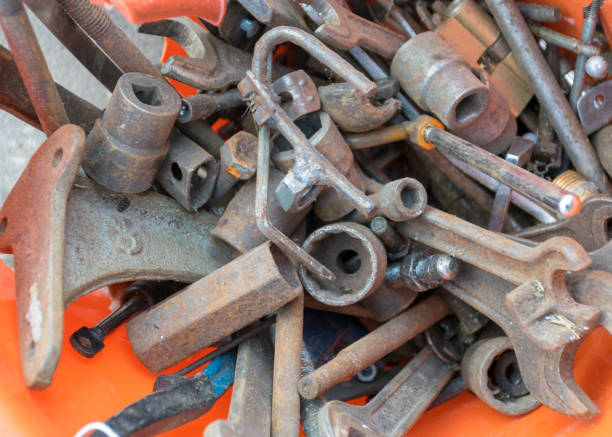 istock metal waste bin, container full of various iron waste, rusty old antique iron tools 1410957360