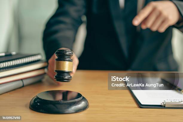 Lawyer Who Works Law At Work For A Consultant Lawyer Idea With A Hammer Put Forward Stock Photo - Download Image Now