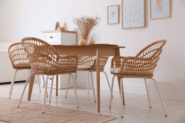 istock Dining room interior with wooden table and wicker chairs 1410960964