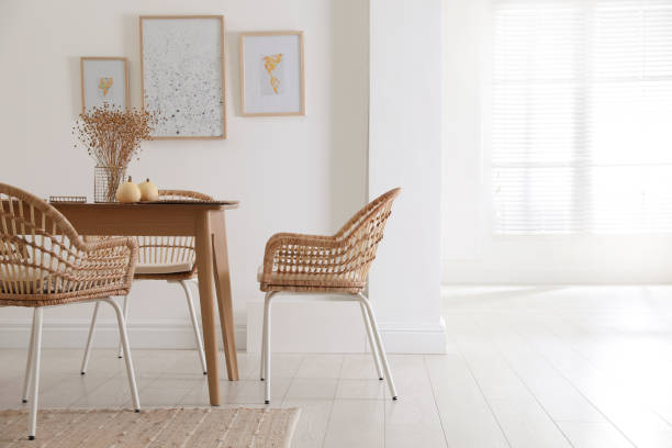 istock Dining room interior with wooden table and wicker chairs 1410961010