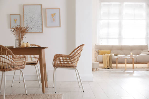 istock Dining room interior with wooden table and wicker chairs 1410961019