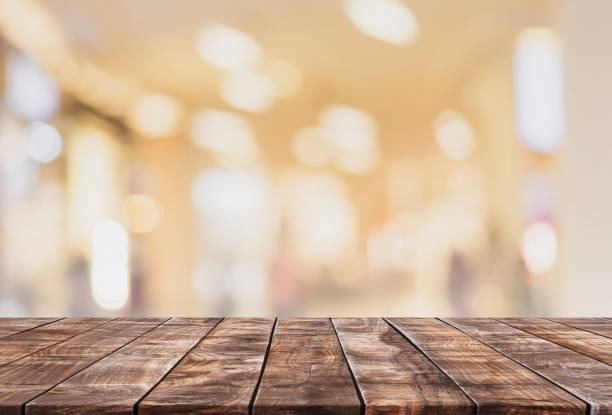 istock Empty wood table top and blurred coffee shop and restaurant interior background - can used for display or montage your products. 1410961116