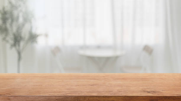 istock Empty wood table top and blurred coffee shop, cafe and restaurant interior background - can used for display or montage your products. 1410961128