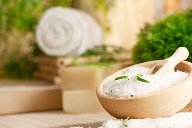Spa setting with bath salt Spa setting with bath salt and towels bath salt photos stock pictures, royalty-free photos & images