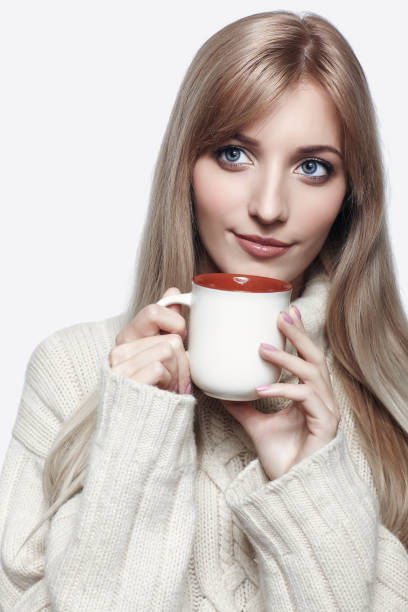 istock Blonde woman drinking a cap of tea 1410965544