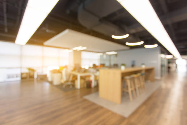 istock Abstract blurred interior of an empty modern loft office open space 1410966533