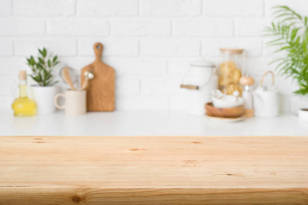 Wood table top on blur kitchen background for product montage stock photo