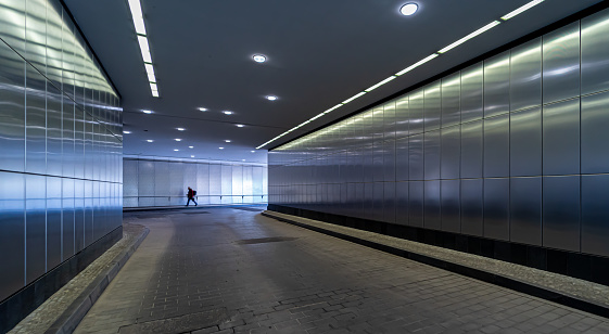 New York City, United States, April 9, 2023 - Connecting walkway and access to the Amtrak Rail Road platforms of Penn Station below the James A. Farley Post Office in Midtown Manhattan, New York.