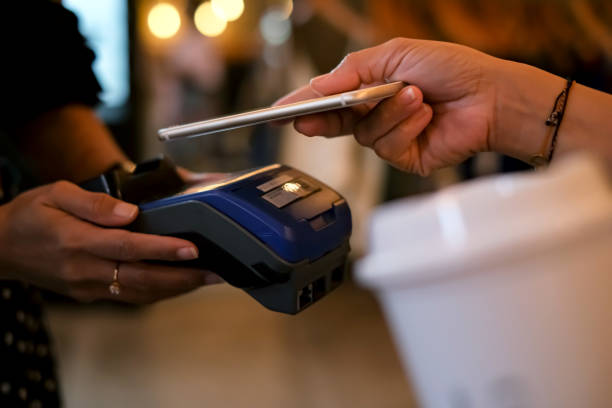 istock Unrecognizable Asian Woman Using Smartphone For Tap To Pay 1410969602